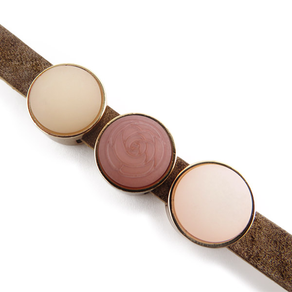 Cuoio armband met zacht roze sliders detail